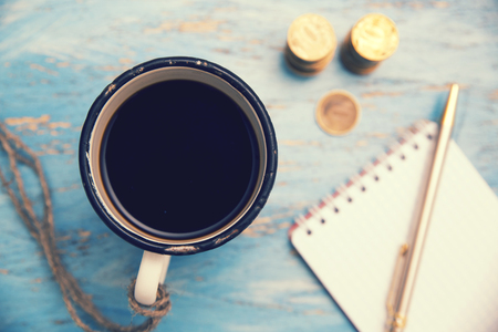 coffee mug, money, notebook and penの写真素材