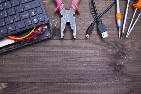 broken laptop and toolsの写真素材