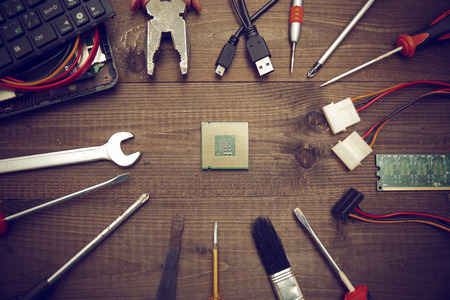broken laptop and toolsの写真素材