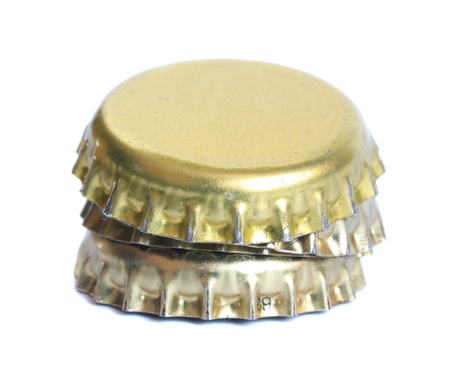Pile of bottle cap from beer on a white background.の写真素材