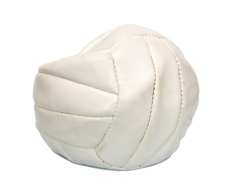 Deflated volleyball ball isolated on white background. の写真素材
