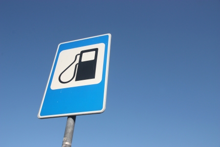 Petrol filling station sign over blue sky.の写真素材