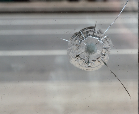 Crack in glass. Broken glass close up.の写真素材
