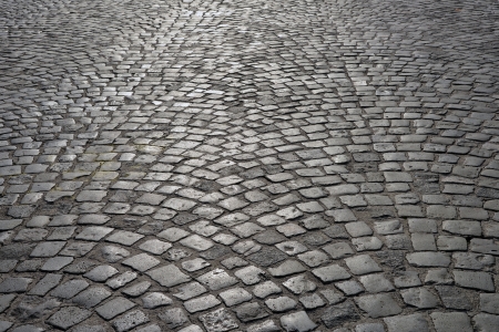 Abstract background of old cobblestone pavement.の写真素材