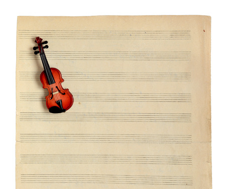 Music notes paper and violin isolated on a white background.の写真素材
