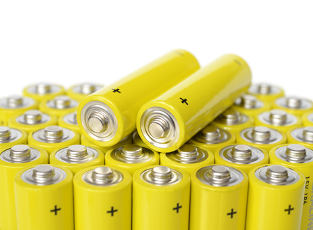 Group of yellow batteries isolated on a white background.の写真素材