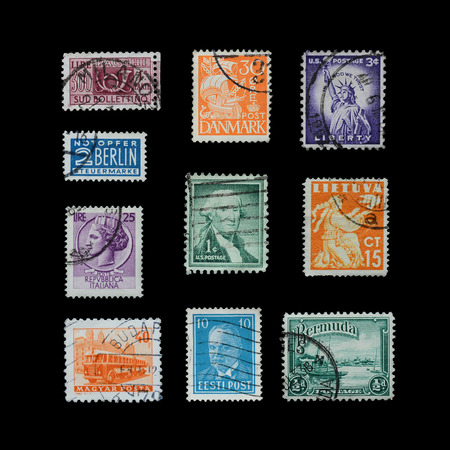 Stamps mail close up on a black background.