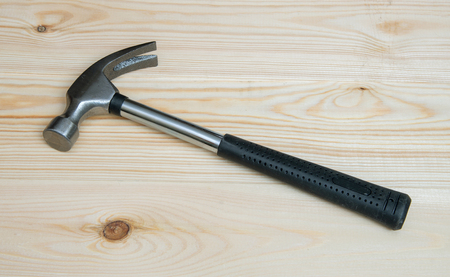 Iron hammer on wooden panels.の写真素材