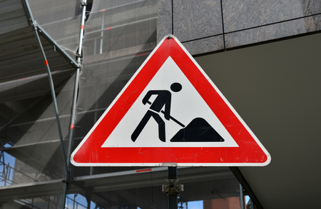 Old road sign roadwork close up.の写真素材