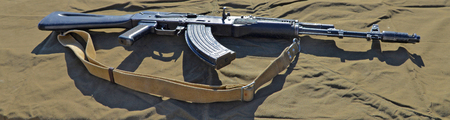 AK-47 assault rifle on a green background.