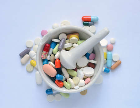 Medical background. Heap of medicine pills and capsules on a white background.の写真素材