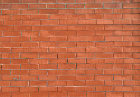 Background. New Red Brick Wall close up.の写真素材