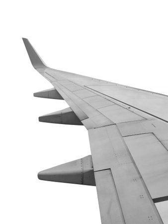 The wing of a passenger aircraft is isolated on a white backgroundの写真素材