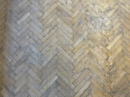 Old dirty wooden parquet, top view. Herringbone setの写真素材