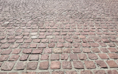 Abstract background. Old cobblestone pavement close-upの写真素材