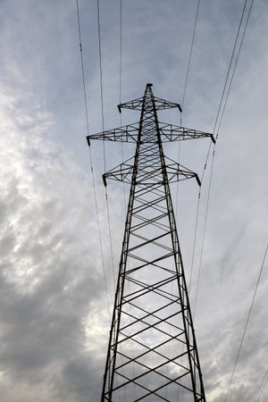 Electric power lines close up against sky