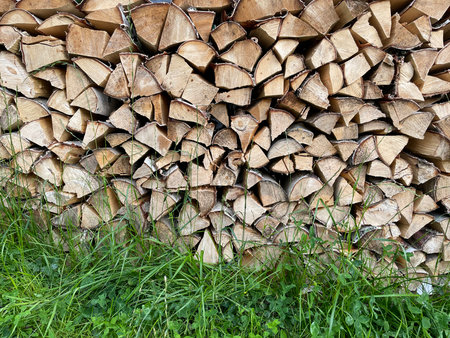 A Stack of wooden firewood close up