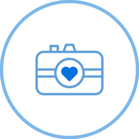 A simple camera icon featuring a heart in the middle of the lens, representing love, photography, and capturing precious moments.のイラスト素材
