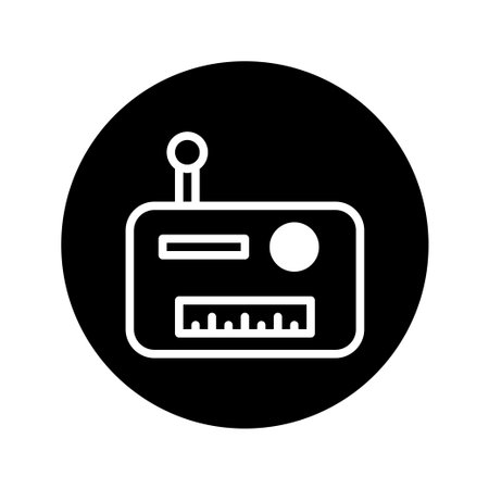 A minimalist icon of a vintage radio with an antenna, set against a black circular background, representing classic audio broadcasting and retro technology.のイラスト素材