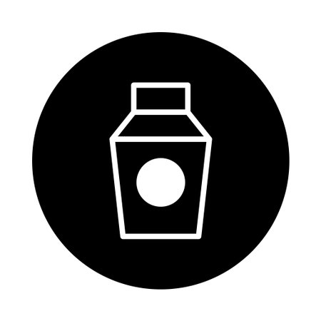 A minimalist illustration shows a white outline of a beverage carton with a round label, set against a solid black background, ideal for branding and product packaging designs.のイラスト素材