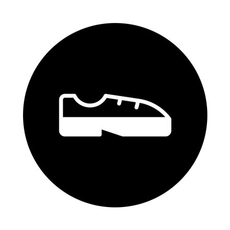 A minimalist footwear symbol in a black circle. Perfect for various projects, especially those related to fashion, sport, or brand design.のイラスト素材