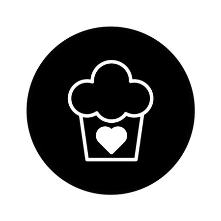 A minimalist illustration of a cupcake adorned with a heart shape. Perfect for designs related to bakeries, dessert shops, or romantic celebrations.のイラスト素材