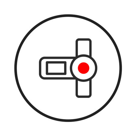 This is a minimalist representation of a camera icon, outlined in black and red, centrally positioned within a black circle. The image evokes a sense of nostalgia and digital capturing technologiesのイラスト素材