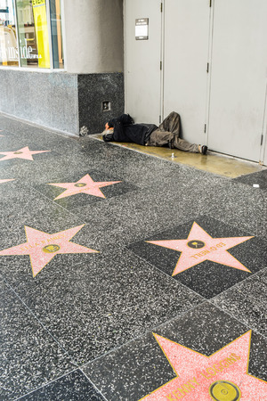 Los Angeles, CA, USA . January 16, 2016: Hollywood Walk of Fame homeless man on the street, sidewalkのeditorial素材