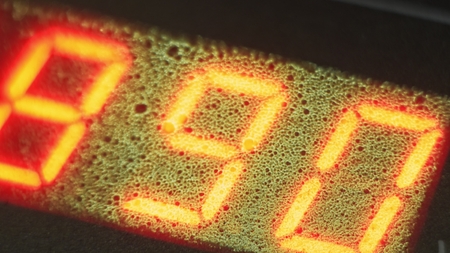 Electronic digital dial meter counter pipe. Manufacture of plastic water pipes of the factory. Process of making plastic tubes on the machine tool with the use of water and air pressure.の写真素材