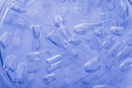 Glass medical ampoule vial for injection. Medicine is liquid sodium chloride with of aqueous...