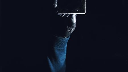 Internal view from inside of the glass a car while being car wash. Washing dishes with a sponge with dishwashing foam gel. Hand holds sponge with detergent or polishing liquid. Polish, or wash dish.の写真素材