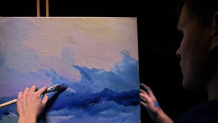 Artist copyist paint seascape with ship in ocean. Craftsman decorator draw as boat sail on blue sea...