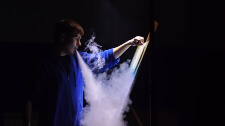 Artist copyist paint seascape with ship in ocean. Vaper smoke vape e-cigarette. Craftsman decorator...