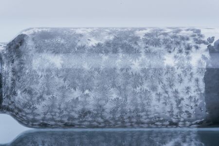 Glass medical ampoule vial for injection. Medicine is dry white drug penicillin powder or liquid with of aqueous solution in ampulla. Close up. Bottles ampule with aluminum cap on backgrounds gray.の写真素材