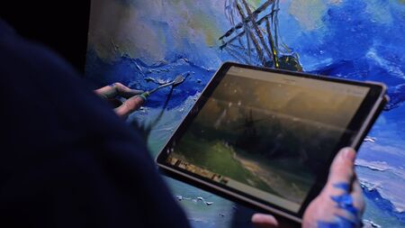 Artist copyist paint seascape with ship in ocean. Craftsman decorator draw as boat sail on blue sea...
