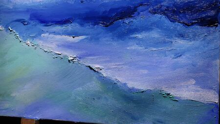Artist copyist paint seascape with ship in ocean. Craftsman decorator draw as boat sail on blue sea with acrylic oil color. Draw finger, brush, knife palette. Indoor. Close up cinematic look.の写真素材