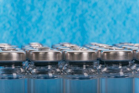 Glass medical ampoule vial for injection. Medicine is liquid sodium chloride with of aqueous...
