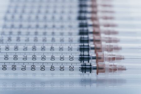 Medicine, Injection, vaccine and disposable syringe isolated, drug concept. Sterile vial medical. Medical Syringe needle. Macro close up on backgrounds gray.の写真素材