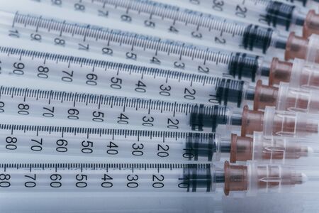 Medicine, Injection, vaccine and disposable syringe isolated, drug concept. Sterile vial medical. Medical Syringe needle. Macro close up on backgrounds gray.の写真素材