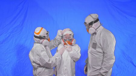 The family shield protect, to save life from virus. Slow motion. People portrait, wearing protect medical aerosol spray paint mask respirator. Concept health safety protection coronavirus epidemic.の写真素材