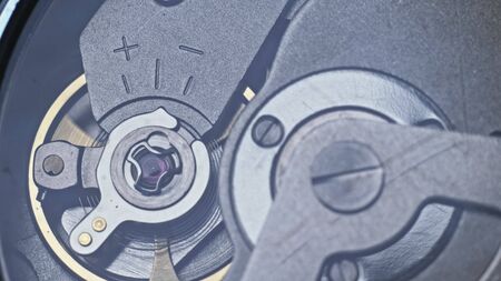 Watch mechanism macro loop. Old vintage clock mechanism working, closeup shot with soft focus. Close up of a internal clock mechanism. Watch gears movement macro. Time Keeping.の写真素材