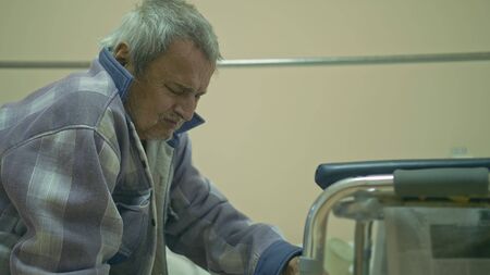 The patient is 72 years old. Extensive polyarthritis. Surgery hip fracture. Real Russian hospital die. A man will die from kidney failure in a week, for him there is no free hemodialysis apparatus.の写真素材