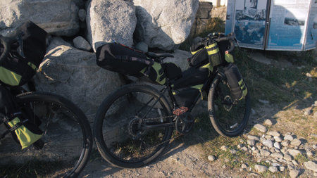 The mixed terrain cycle touring bike with bikepacking. The travel journey with light bicycle bags...