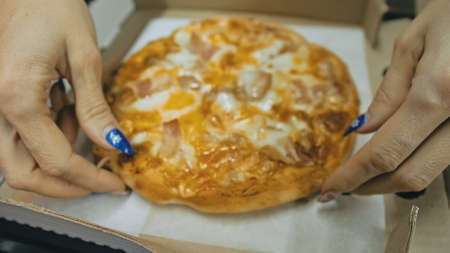 Girl eat pizza cheese four. Close up of young woman mouth greedily eating pizza and chewing in...