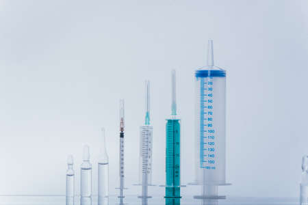 Medicine, Injection, vaccine and disposable syringe, drug concept. Sterile vial medical syringe...