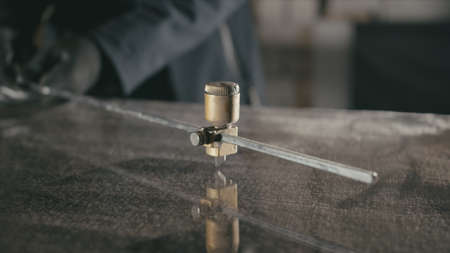 Glass cutting and processing for fireplace doors. Circular glassの写真素材