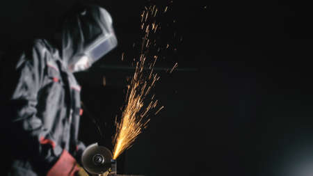 Forge workshop. Smithy manual production. Close up details of sparks, industrial worker using angle...