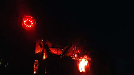 The roof of the house is on fire. The residential building burn, village. Firefighters put out a...