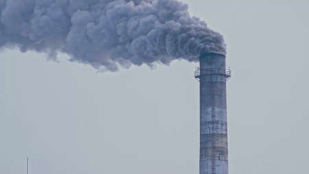 This smoke coming from the chimney in a factory. Harmful emissio