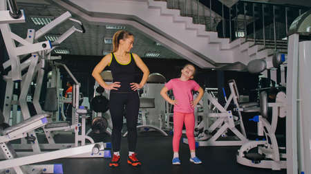 Mother and Daughter in the Gym, Family Performs Physical doing Eの写真素材